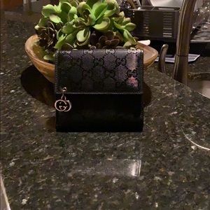 Gucci Wallet. Small tear on coin pocket